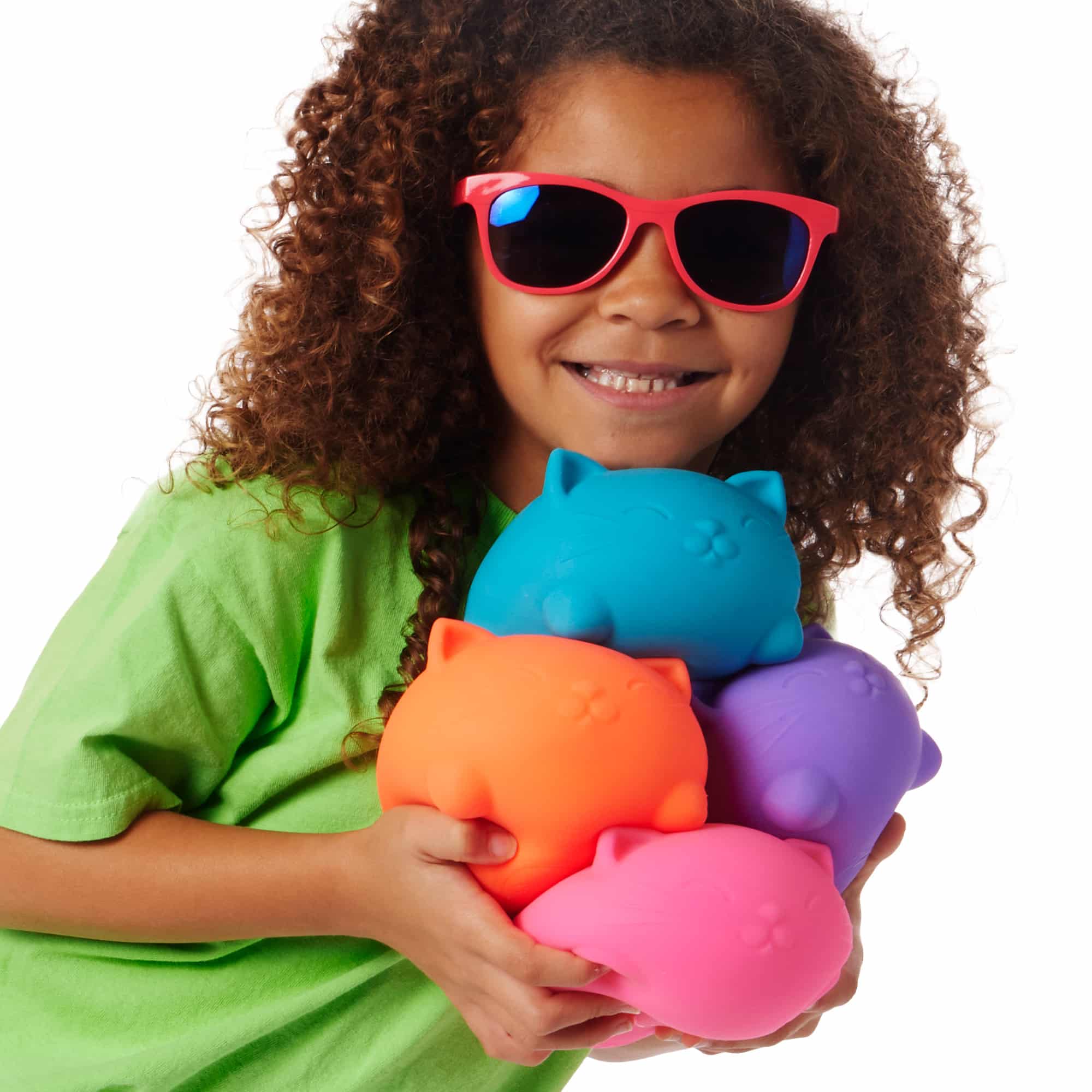 NeeDoh Super Cool Cats L0 - Lifestyle with girl holding all four colors Super Cool Cats L0