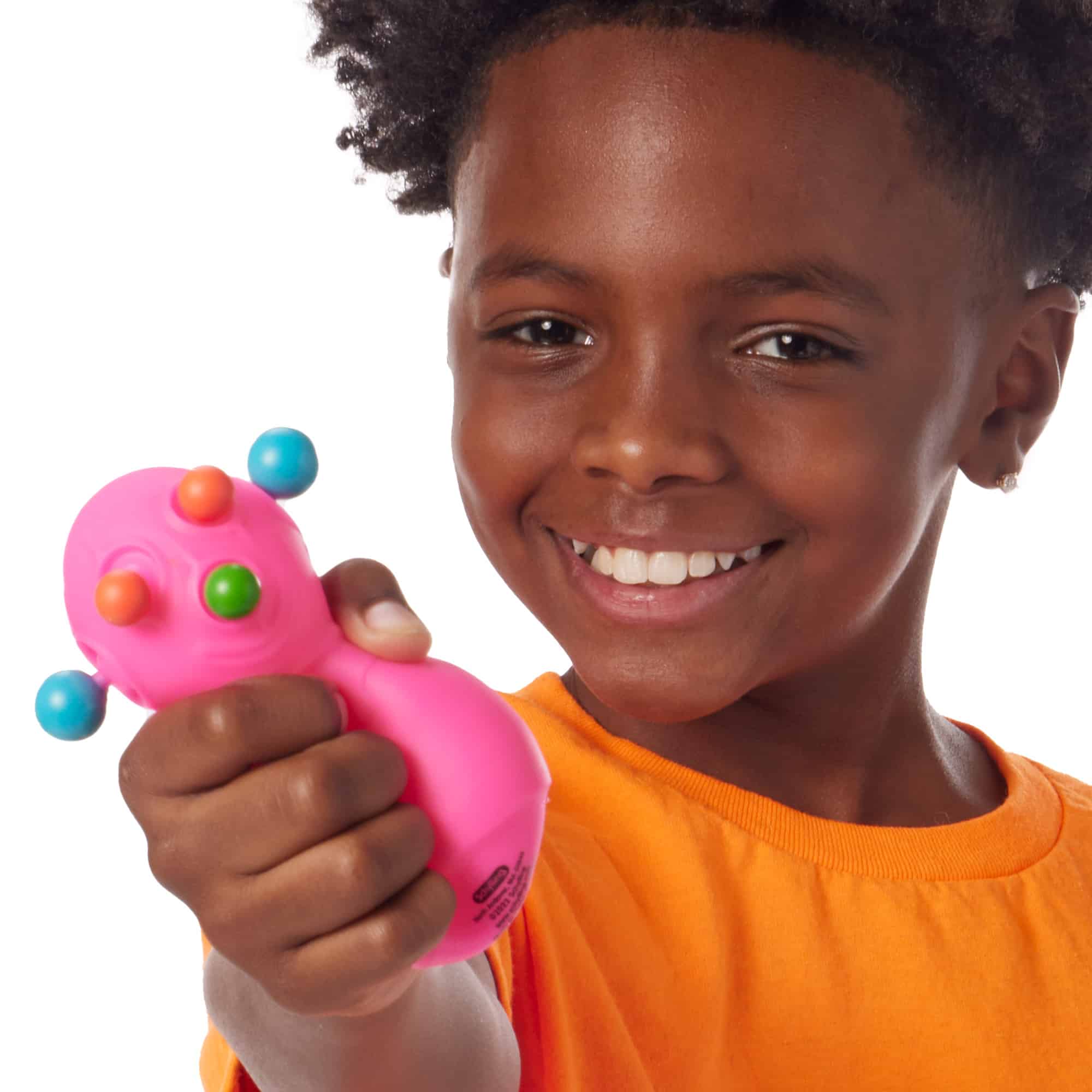 NeeDoh Panic Pete F0 Lifestyle closeup of happy boy squeezing pink Panic Pete F0